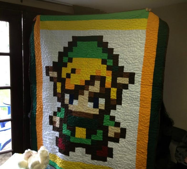 Hand made baby blanket depicting "The Legend of Zelda" Link. Created pixel perfect and stitched by a loving gradmother