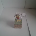 Chicken on a grass block from minecraft made out of paper