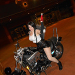 Tiffa Lockheart cosplay on back of a motorbike with the buster sword